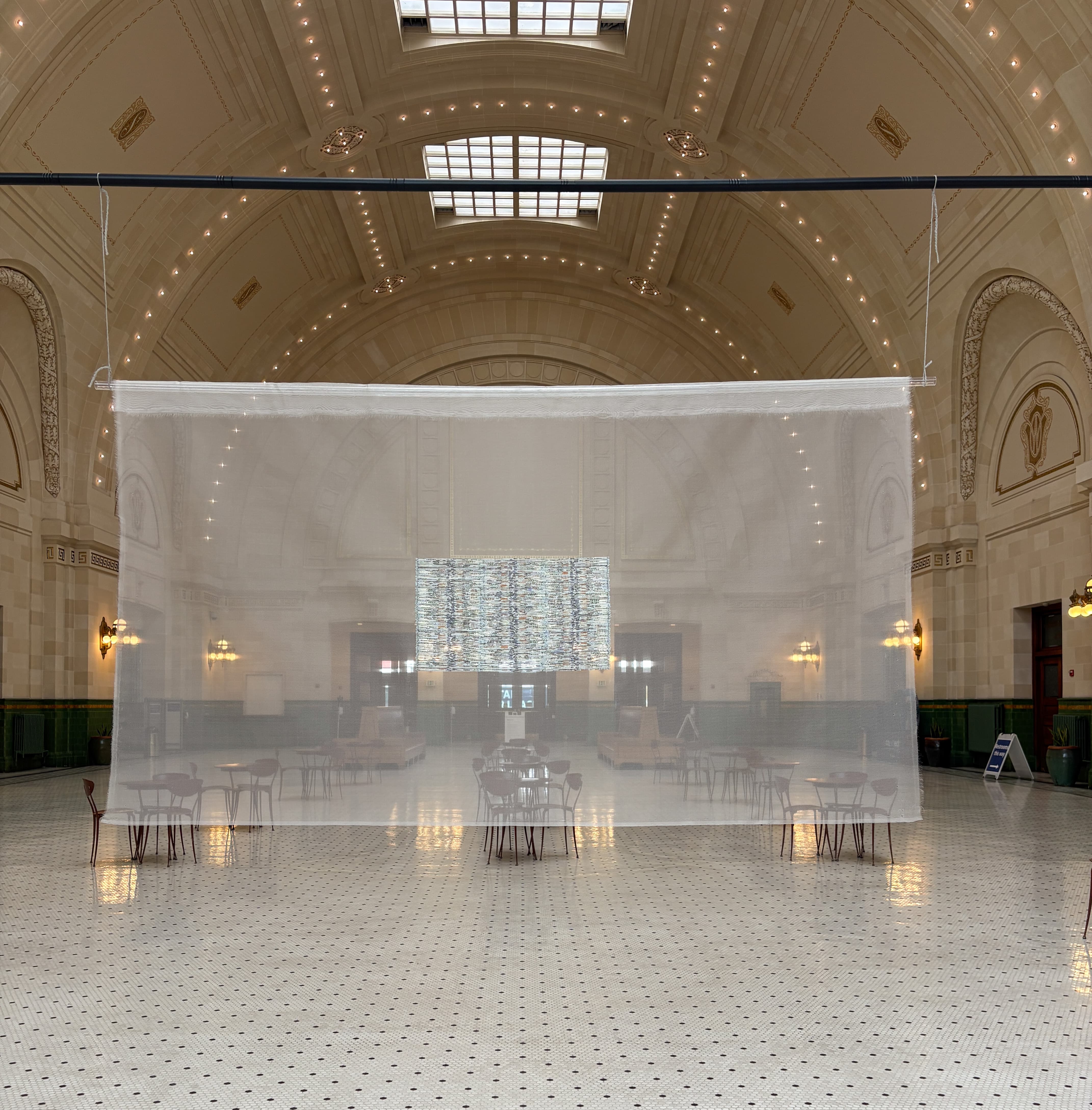 $1,000 installed in a large translucent silk mesh panel.