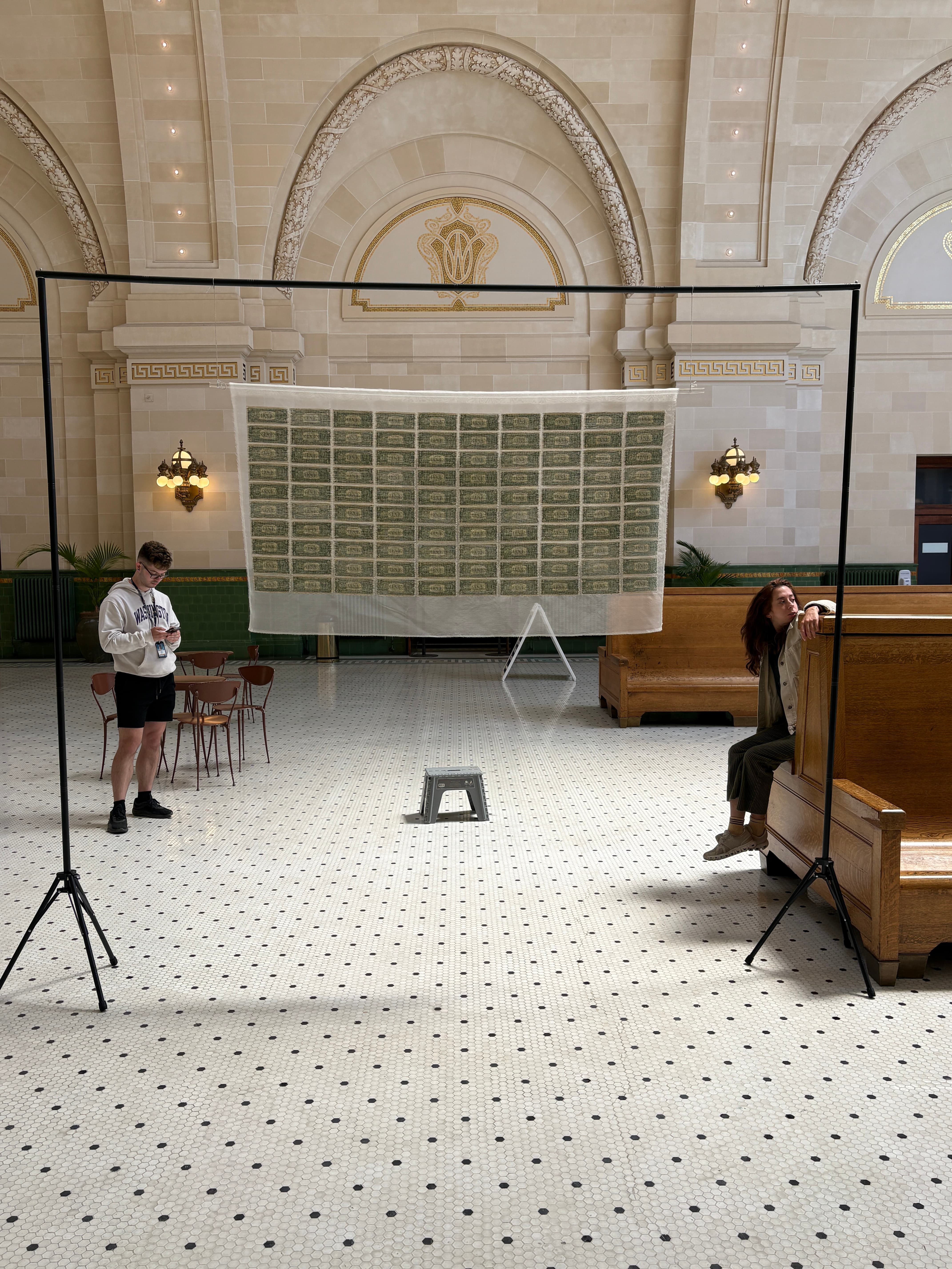 Installing and documenting the reconstructed currency work at Union Station.