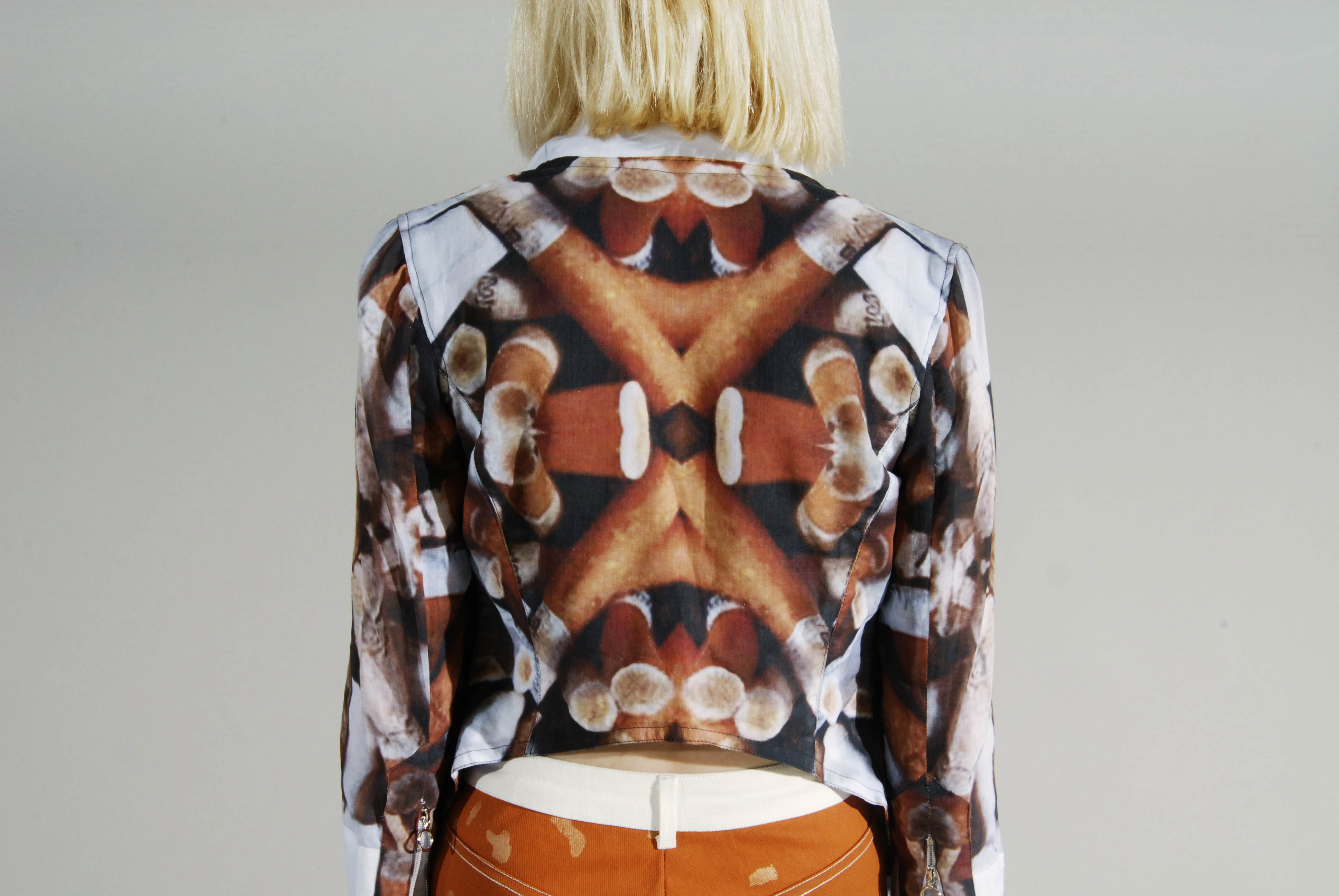Detail of printed textile and garment construction from Smoking Kills.