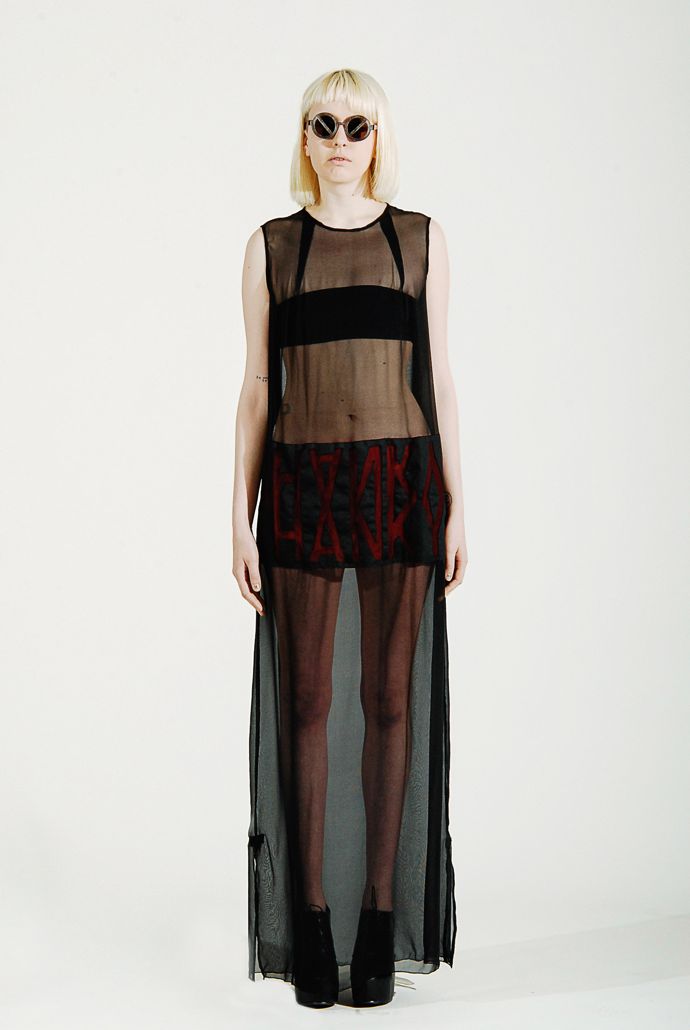 Front view of Look 05 from Smoking Kills, featuring a floor-length sheer black garment.